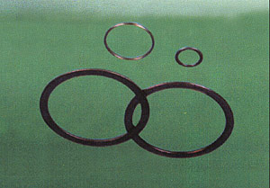 METAL PACKING COMPOUND SPACER